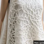 바이오패브릭과 기업의 지속 가능성 목표 - A close-up shot of a luxurious biofabric textile made from mushroom mycelium, showing its unique tex...